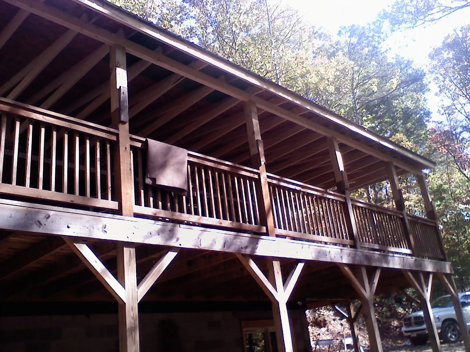 Timber framing under a new elevated porch and deck — Roof Leak Repair in Nauvoo by Roofing Brothers